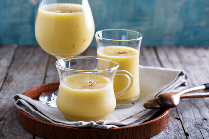 Mango smoothie with saffron in three different glasses